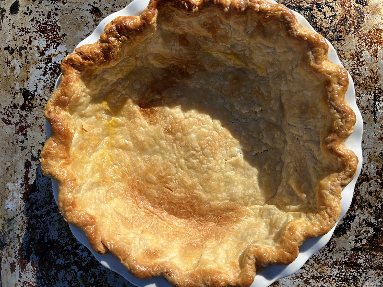 a fully baked pie crust prior to filling